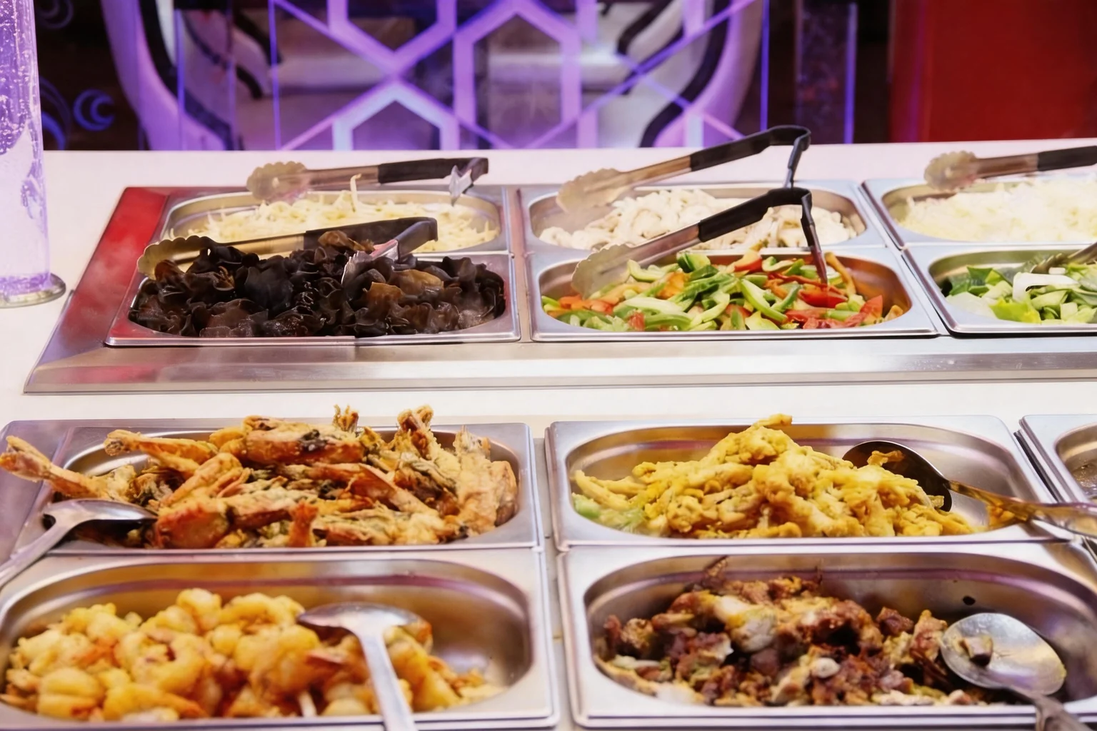 Fried specialities and stir-fried vegetables at the buffet counter